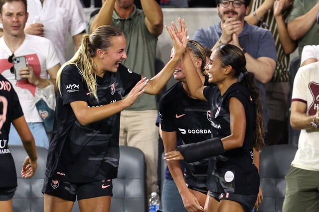 Angel City FC forward Alyssa Thompson, right, celebrates with midfielder Evelyn Shores after Thompson scored in the 86th minute of their game against Orlando Pride SC on Thursday night at BMO Stadium. Angel City held on for a 1-0 win. (Photo by Raul Romero Jr., Contributing Photographer)
