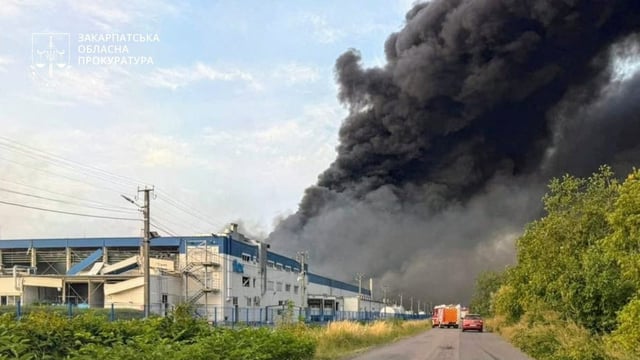 Smoke rises over the Flextronics factory hit by a Russian missile strike, amid Russia's attack on Ukraine, in Mukachevo, Zakarpattia region, Ukraine August 21, 2025. Zakarpattia Regional Prosecutor's Office/Handout via REUTERS