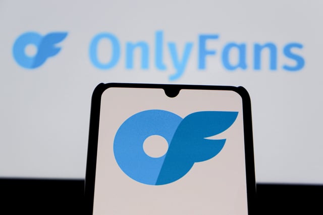 August 12, 2025, Indonesia: In this photo illustration, the OnlyFans logo is seen displayed on a mobile phone and in the background. (Credit Image: © Algi Febri Sugita/SOPA Images via ZUMA Press Wire