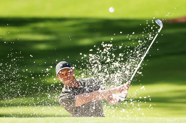 Woods plays a shot from the bunker on the second hole during the Masters on November 12, 2020.