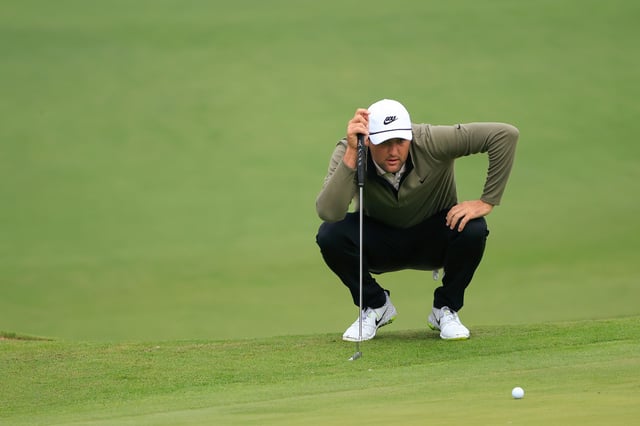 Scheffler lines up a putt during the Masters on November 15, 2020.