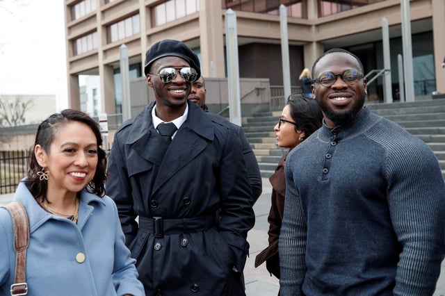 Abimbola “Abel” Osundairo, center, and Olabinjo “Ola” Osundairo with their attorney Gloria Rodriguez outside of the courthouse in Chicago on Feb. 24, 2020.