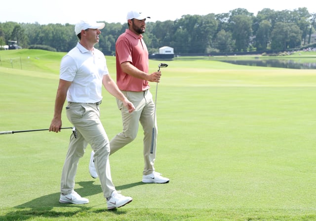 ATLANTA, GEORGIA - AUGUST 21: Rory McIlroy of Northern Ireland and Scottie Scheffler of the United States walk off the ninth tee during the first round of the TOUR Championship 2025 at East Lake Golf Club on August 21, 2025 in Atlanta, Georgia. (Photo by Kevin C. Cox/Getty Images)