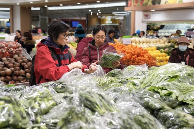 Customers shop for produce at T&T Supermarket's location in Toronto's Fairview Mall, Friday, Nov. 28, 2024. THE CANADIAN PRESS/Chris Young
