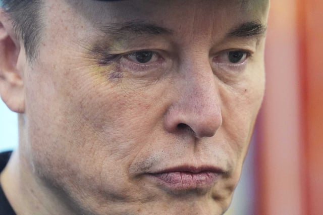 Elon Musk attends a news conference with President Donald Trump in the Oval Office of the White House, May 30, 2025, in Washington. The billionaire Tesla CEO reached a tentative settlement to pay $500 million to 6,000 former Twitter employees who say they were denied severance after his takeover.