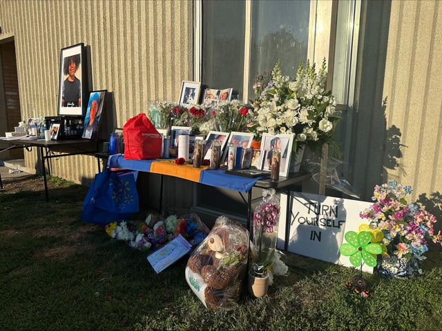 At a vigil for JahVai Roy, there was a table lined with flowers, candles and photos of the eight-year-old boy, who was killed by a stray bullet in his North York apartment building.