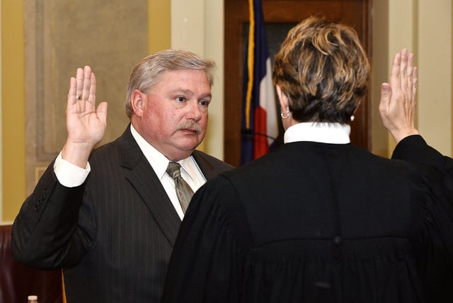 Brian Cotter is sworn into the Pueblo County Coroner's Office for his first term as coroner in 2015.