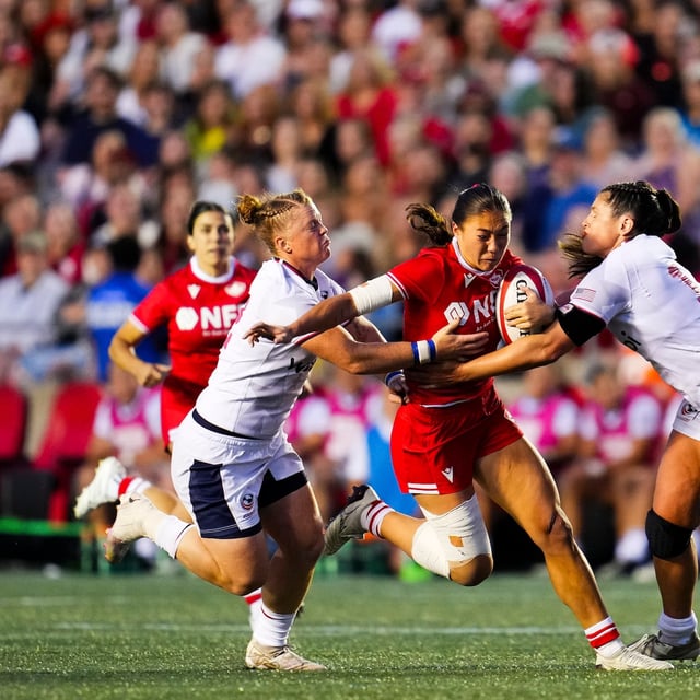 Canada's Florence Symonds (centre) runs the ball between USA's Alev Kelter (left), and Ilona Maher (right) during the second half of Women's rugby action in Ottawa on Friday, Aug. 1, 2025.