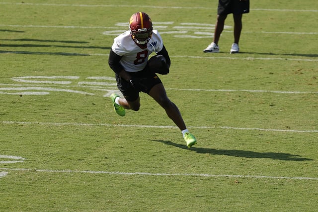 Jul 24, 2025; Ashburn, VA, USA; Washington Commanders running back Brian Robinson Jr. (8) carries the ball during practice on day two of training camp at OrthoVirginia Training Center at Commanders Park. Mandatory Credit: Geoff Burke-Imagn Images/ File Photo