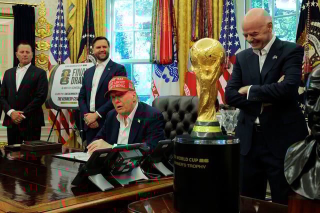 President Donald Trump speaks in the Oval Office while FIFA President Gianni Infantino and Vice President JD Vance look on. Trump announced the FIFA World Cup 2026 draw will take place at The Kennedy Center.