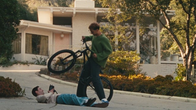 Two boys, one bike.