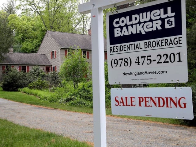 This Tuesday, May 24, 2016, photo shows a "Sale Pending" sign in front of a house in North Andover, Mass. On Thursday, May 26, 2016, the National Association of Realtors releases its April report on pending home sales, which are seen as a barometer of future purchases. (AP Photo/Elise Amendola)