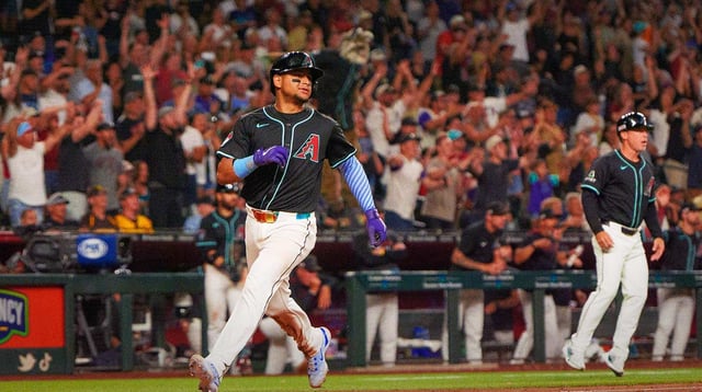 Jun 14, 2025; Phoenix, Arizona, USA; Arizona Diamondbacks catcher Gabriel Moreno (14) comes in to score in the ninth inning against the San Diego Padres at Chase Field. Mandatory Credit: Allan Henry-Imagn Images