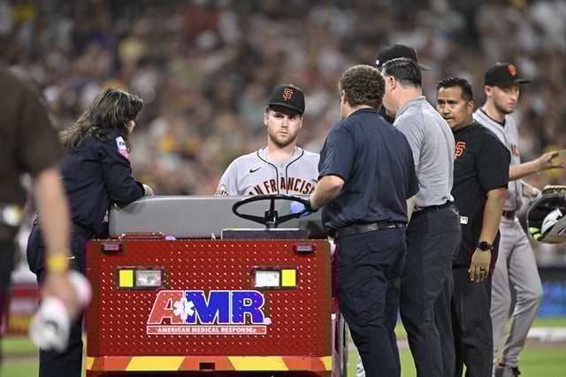 Aug 20, 2025; San Diego, California, USA; San Francisco Giants starting pitcher Landen Roupp (65) sits in a cart after being hit by a ball hit by San Diego Padres right fielder Ramon Laureano (5) during the third inning at Petco Park. Mandatory Credit: Denis Poroy-Imagn Images
