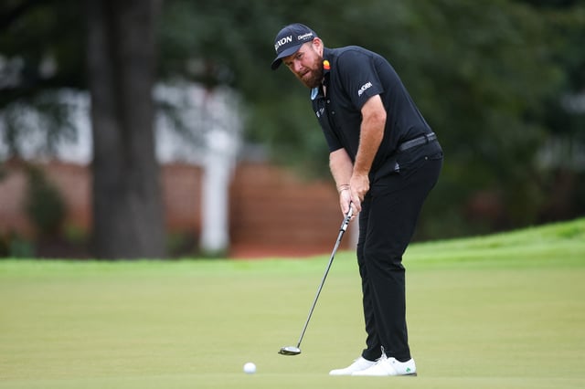 Aug 22, 2025; Atlanta, Georgia, USA; Shane Lowry putts on the second green during the second round of the TOUR Championship golf tournament. Mandatory Credit: Brett Davis-Imagn Images