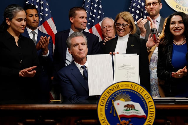 California Gov. Gavin Newsom signs bills related to redrawing the state’s congressional maps on Aug. 21, 2025, in Sacramento, Calif.