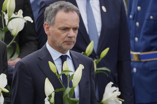 FILE - Netherlands' Foreign Minister Caspar Veldkamp lays flowers during a wreath laying ceremony on the 30th anniversary of Srebrenica massacre at the Memorial Center in Potocari, Bosnia, July 11, 2025. (AP Photo/Darko Bandic, File)
