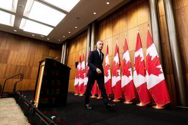 Prime Minister Mark Carney departs a press conference at the National Press Theatre in Ottawa, on Friday, Aug. 22, 2025. THE CANADIAN PRESS/Spencer Colby