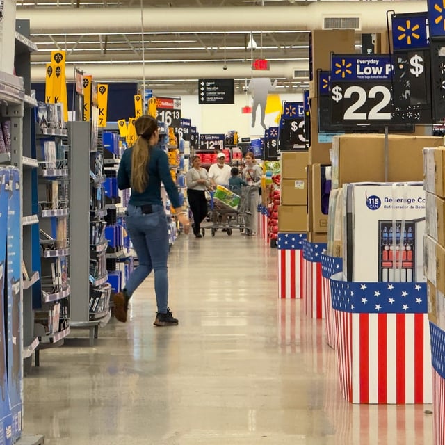 People walk at a Walmart store in Oceanside, California, U.S., May 15, 2025. REUTERS/Mike Blake/File Photo