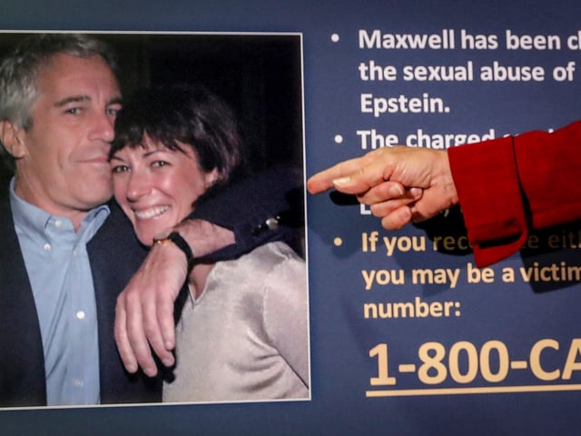 FILE - Audrey Strauss, acting U.S. attorney for the Southern District of New York, points to a photo of Jeffrey Epstein and Ghislaine Maxwell, during a news conference in New York on July 2, 2020. (AP Photo/John Minchillo, File)