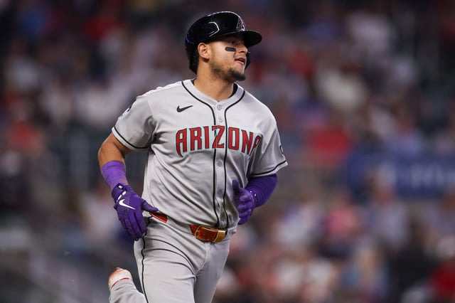 Jun 3, 2025; Atlanta, Georgia, USA; Arizona Diamondbacks catcher Gabriel Moreno (14) hits a single against the Atlanta Braves in the ninth inning at Truist Park. Mandatory Credit: Brett Davis-Imagn Images/ File Photo