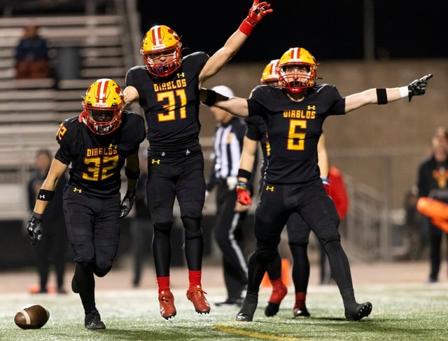 Los Alamitos’  Jackson Bennett (24), center, tackles Mission Viejo’s wide receiver Phillip Bell (1) as he runs the ball during a football game at Mission Viejo High School in Mission Viejo on Friday, Nov. 1, 2024. (Photo by Rebecca Villagracia, Contributing Photographer)