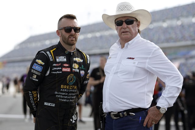 Austin Dillon, driver of the #3 BREZTRI Chevrolet, speaks with his grandfather, RCR team owner and NASCAR Hall of Famer, Richard Childress during qualifying for the NASCAR Cup Series Coke Zero Sugar 400 at Daytona International Speedway on August 25, 2023 in Daytona Beach, Florida.