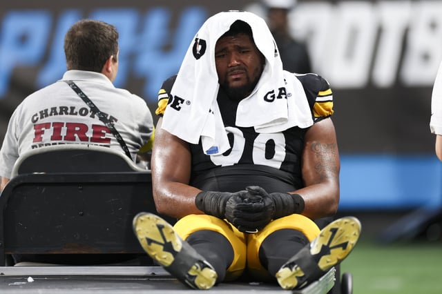 Derrick Harmon #99 of the Pittsburgh Steelers is carted off during the first half of the NFL Preseason 2025 game against the Carolina Panthers at Bank of America Stadium on August 21, 2025 in Charlotte, North Carolina.