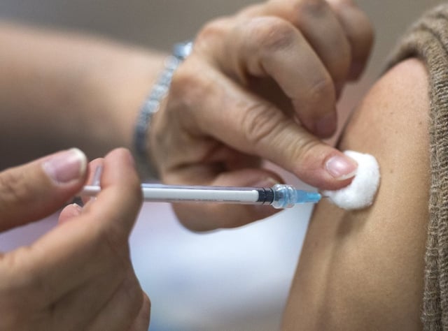 A person gets the COVID-19 vaccine on Friday, April 30, 2021, in Montreal. THE CANADIAN PRESS/Ryan Remiorz