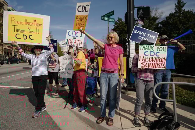 People demonstrate outside the main campus of the Centers For Disease Control and Prevention (CDC) on April 1, 2025 in Atlanta, Georgia.
