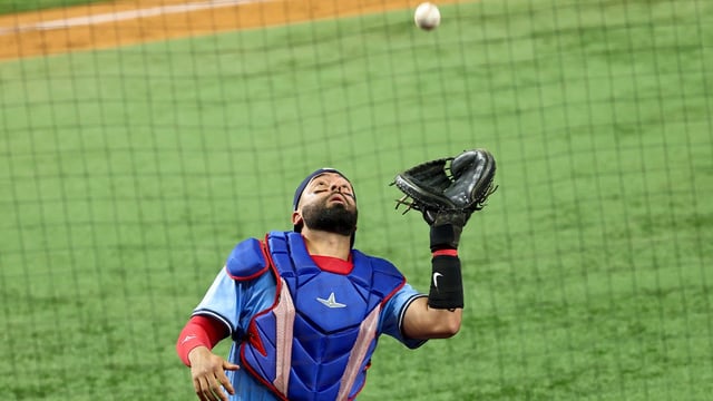 May 28, 2025; Arlington, Texas, USA; Toronto Blue Jays catcher Ali Sanchez (20) makes a catch during the eighth inningagainst the Texas Rangers at Globe Life Field. Mandatory Credit: Kevin Jairaj-Imagn Images