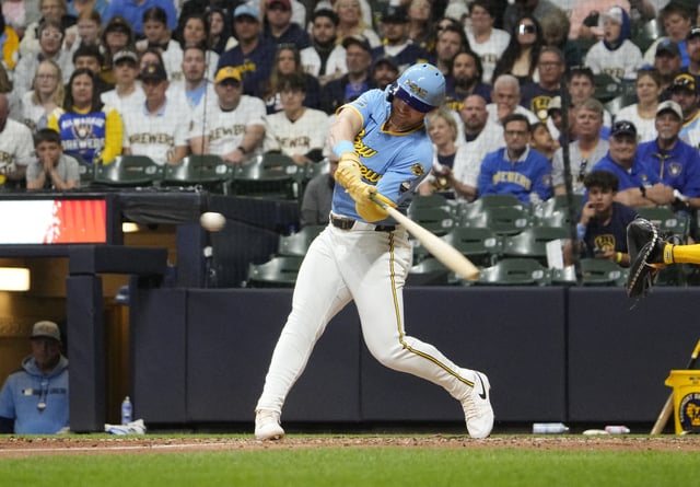Jun 7, 2025; Milwaukee, Wisconsin, USA; Milwaukee Brewers outfielder Jake Bauers (9) hits a sacrifice fly to score a run against the San Diego Padres in the seventh inning at American Family Field. Mandatory Credit: Michael McLoone-Imagn Images/ File Photo