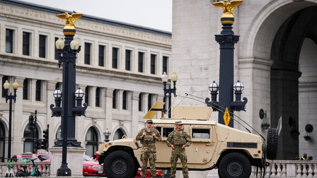 Members of the National Guard stand near a Humvee outside of Union Station