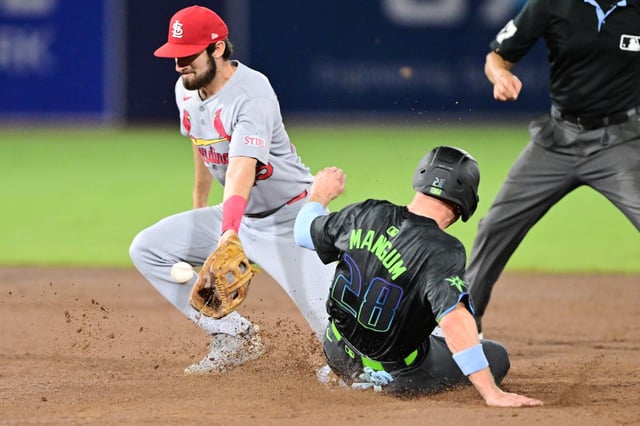 TAMPA, FLORIDA - AUGUST 22: Jake Mangum #28 of the Tampa Bay Rays steals second base before Thomas Saggese #25 of the St. Louis Cardinals can make the tag in the third inning at George M. Steinbrenner Field on August 22, 2025 in Tampa, Florida. (Photo by Julio Aguilar/Getty Images)