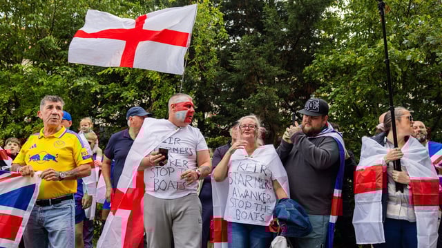 Anti-immigration protesters outside the Britannia hotel in Seacroft, Leeds in August 2025. Image: Milo Chandler/Alamy Live News