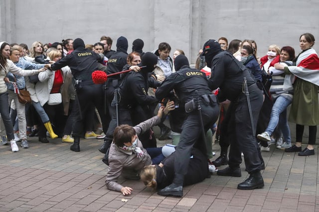 FILE - Police officers detain protesters during a rally in Minsk, Belarus, on Sept. 8, 2020, in support of opposition figure Maria Kolesnikova following a disputed presidential election the previous month. (AP Photo, File)
