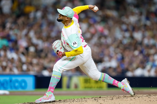 Aug 22, 2025; San Diego, California, USA; San Diego Padres relief pitcher Robert Suarez (75) throws a pitch during the ninth inning against the Los Angeles Dodgers at Petco Park. Mandatory Credit: David Frerker-Imagn Images