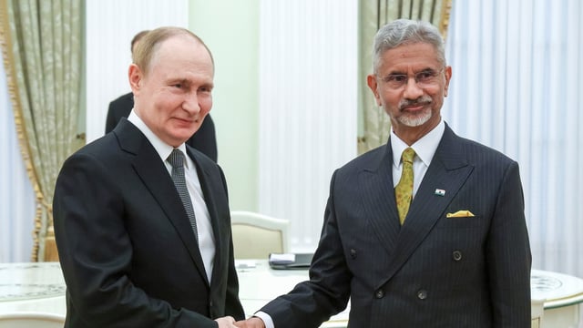 Russian President Vladimir Putin, left, and Indian external affairs minister Subrahmanyam Jaishankar shake hands during their meeting in Moscow on Thursday,