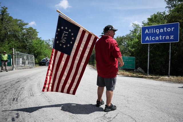 OCHOPEE, FLORIDA - JULY 12: David Mourer visits the entrance to "Alligator Alcatraz" at the Dade-Collier Training and Transition Airport on July 12, 2025, in Ochopee, Florida. Members of Congress were given their first visit to the new state-managed immigration detention facility in the Florida Everglades that officials have named “Alligator Alcatraz.” (Photo by Joe Raedle/Getty Images)