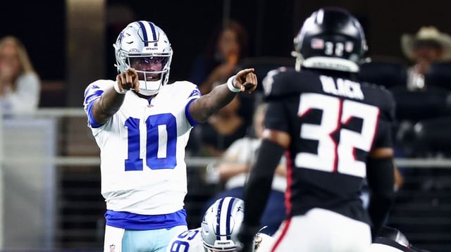 Aug 22, 2025; Arlington, Texas, USA; Dallas Cowboys quarterback Joe Milton III (10) points at Atlanta Falcons safety Henry Black (32) during the first half at AT&T Stadium. Mandatory Credit: Kevin Jairaj-Imagn Images