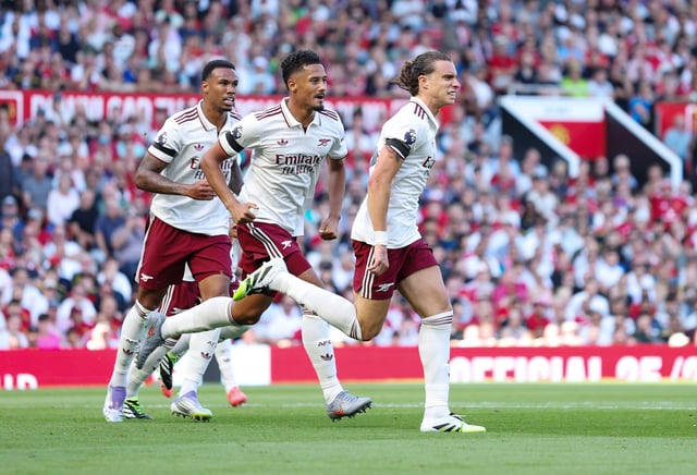 Riccardo Calafiori of Arsenal celebrates scoring his team's first goal with teammate Gabriel Martinelli during the Premier League match between Manchester United and Arsenal at Old Trafford on August 17, 2025 in Manchester, England.