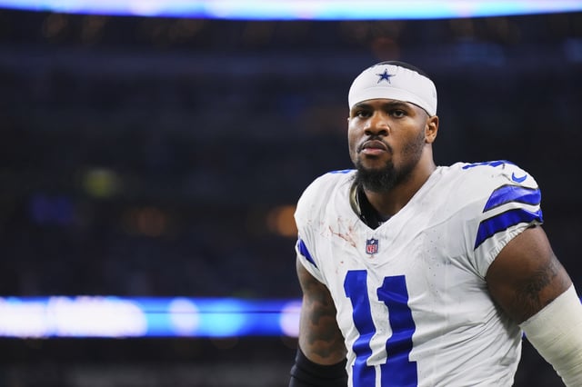 Micah Parsons #11 of the Dallas Cowboys walks towards the locker room against the Tampa Bay Buccaneers during an NFL football game at AT&T Stadium on December 22, 2024 in Arlington, Texas.