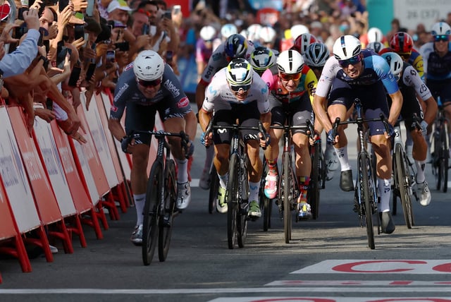 Cycling - Vuelta a Espana - Stage 1 - Turin to Novara - Novara, Italy - August 23, 2025 Alpecin - Deceuninck's Jasper Philipsen in action before crossing the line to win stage 1 REUTERS/Manon Cruz