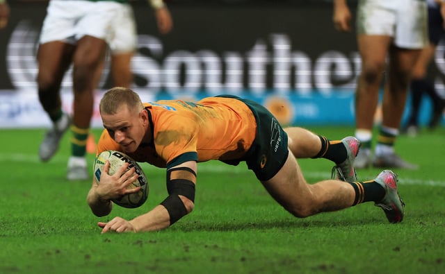 Rugby Union - Rugby Championship - South Africa v Australia - DHL Stadium, Cape Town, South Africa - August 23, 2025  Australia's Max Jorgensen scores a try REUTERS/Esa Alexander
