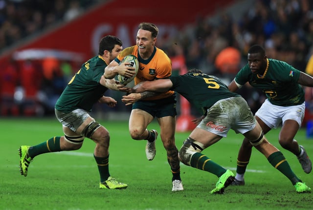 Rugby Union - Rugby Championship - South Africa v Australia - DHL Stadium, Cape Town, South Africa - August 23, 2025  Australia's Corey Toole in action with South Africa's Ruan Nortje REUTERS/Esa Alexander
