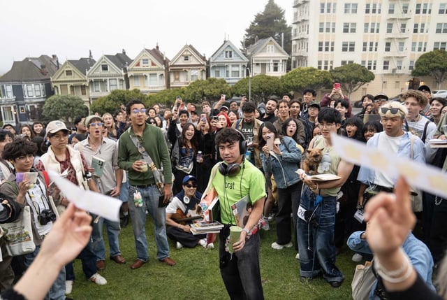Matt Jereza dons a Charli XCX Brat shirt while being judged by an all-women panel during a performative male contest at Alamo Square Park in San Francisco.