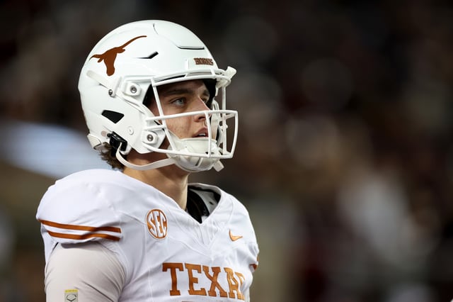 Arch Manning #16 of the Texas Longhorns warms up before the game against the Texas A&M Aggies at Kyle Field on November 30, 2024 in College Station, Texas.