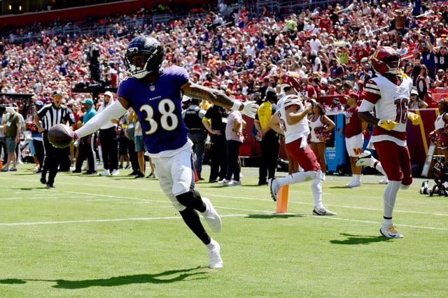 Baltimore Ravens cornerback Keyon Martin (38) celebrates after intercepting a pass and running it back for a touchdown during the first half of a preseason NFL football game against the Washington Commanders Saturday, Aug. 23, 2025, in Landover, Md. (AP Photo/Nick Wass)