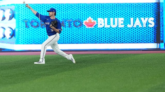 Aug 12, 2025; Toronto, Ontario, CAN; Toronto Blue Jays pitcher Shane Bieber (57) throws balls during batting practice before a game against the Chicago Cubs at Rogers Centre. Mandatory Credit: Nick Turchiaro-Imagn Images