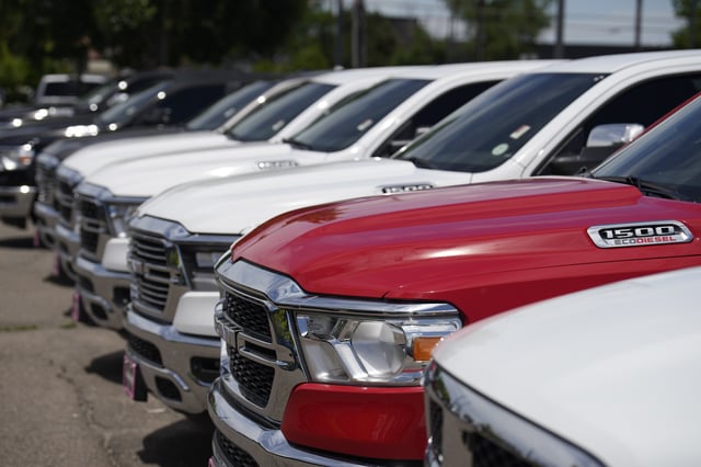 FILE - Unsold 2023 1500 pickup trucks sit in a long row at a Ram dealership on June 18, 2023, in Littleton, Colo. (AP Photo/David Zalubowski, File)